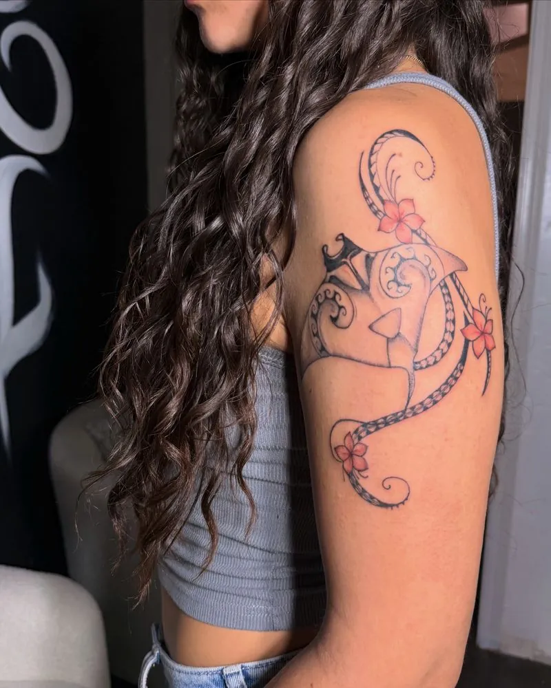 Custom Chamorro tribal shoulder tattoo with red hibiscus flowers